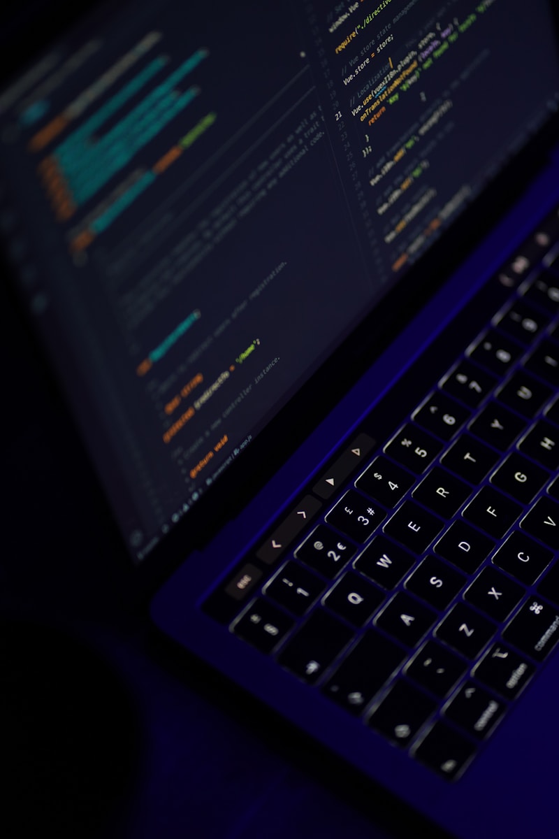 black laptop computer turned on showing microsoft word